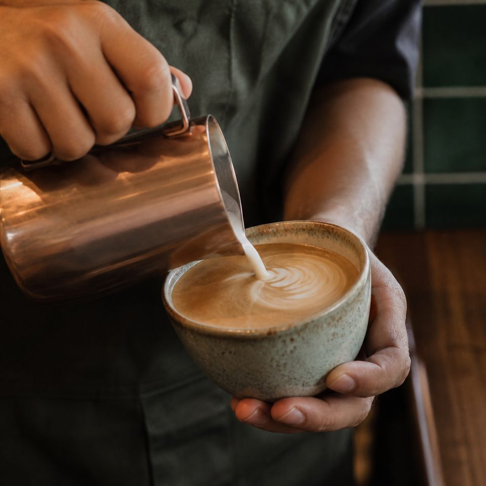 Barista crafting a coffee
